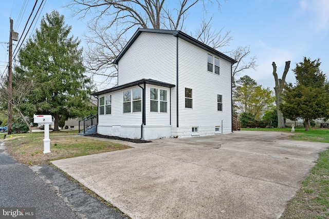 view of property exterior featuring driveway