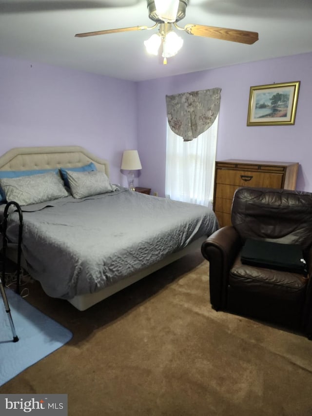 carpeted bedroom featuring a ceiling fan