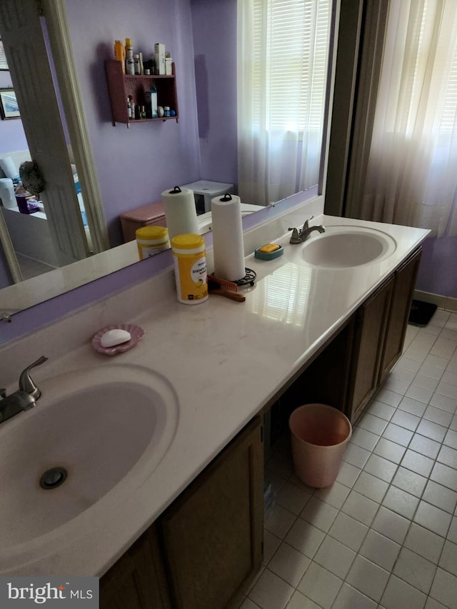 bathroom featuring tile patterned floors and vanity