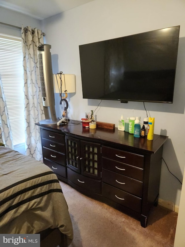 bedroom featuring light colored carpet
