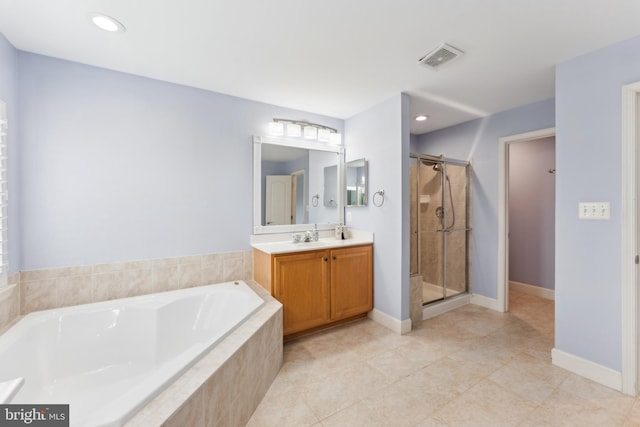 bathroom with a shower stall, tile patterned floors, a bath, vanity, and visible vents