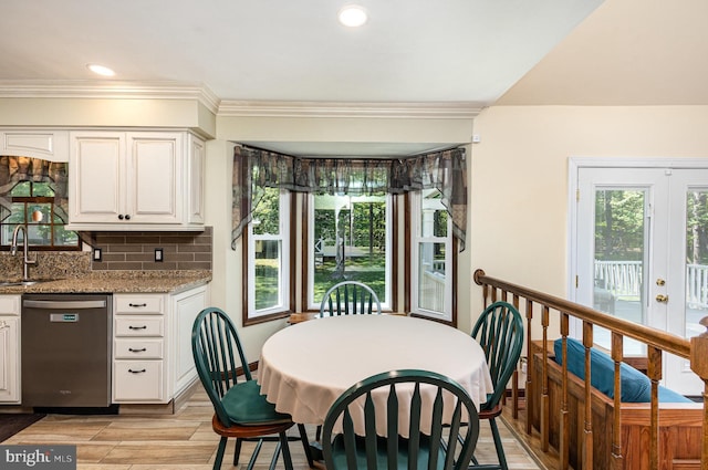 dining area featuring crown molding, recessed lighting, french doors, and light wood finished floors