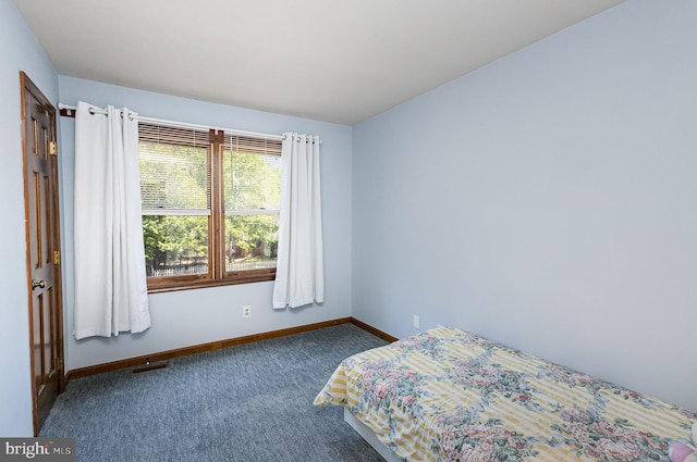 bedroom with baseboards, carpet, and visible vents