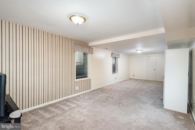 basement featuring carpet floors and baseboards