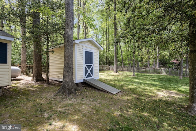 view of shed with fence