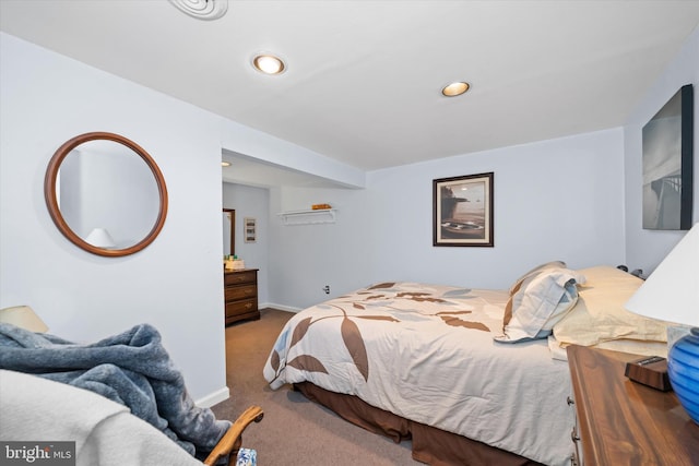 carpeted bedroom featuring recessed lighting and baseboards