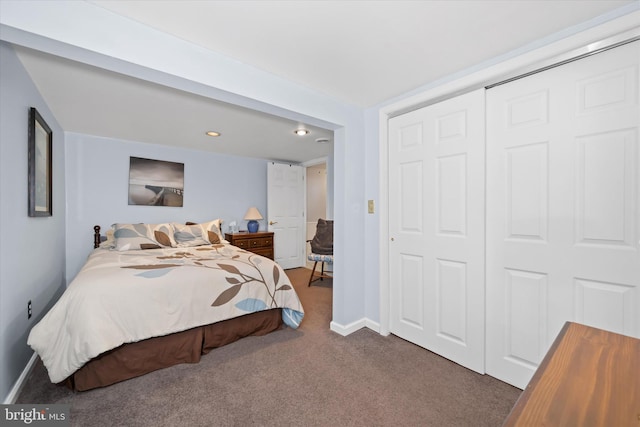bedroom with recessed lighting, a closet, carpet flooring, and baseboards