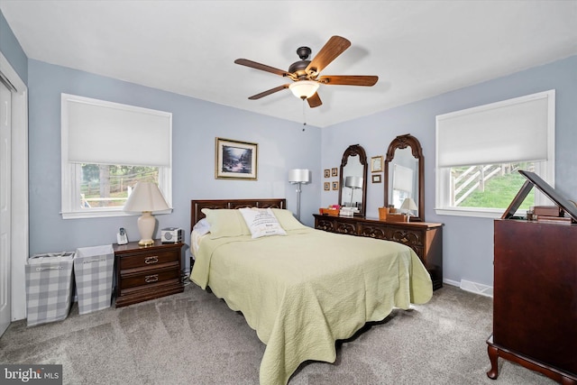 bedroom with carpet, a ceiling fan, and baseboards