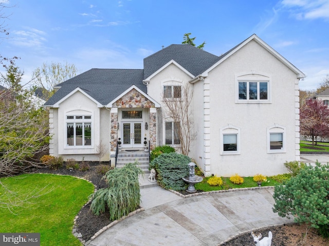 28 Vanessa Ct, Cherry Hill, NJ 08003 - view of front of house with french doors, stucco siding, stone siding, and roof with shingles