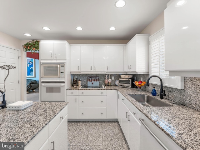 28 Vanessa Ct, Cherry Hill, NJ 08003 - kitchen featuring white appliances, granite floors, tasteful backsplash, recessed lighting, and white cabinetry