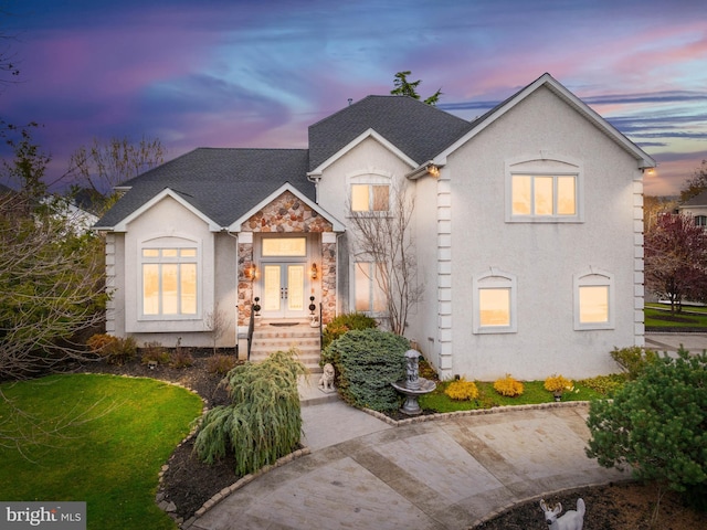 28 Vanessa Ct, Cherry Hill, NJ 08003 - view of front facade with french doors, stone siding, stucco siding, and a shingled roof