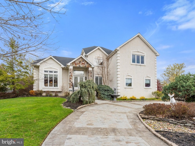 28 Vanessa Ct, Cherry Hill, NJ 08003 - view of front facade with a front lawn, stucco siding, stone siding, and driveway
