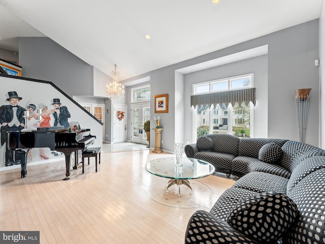 28 Vanessa Ct, Cherry Hill, NJ 08003 - living room with high vaulted ceiling, a chandelier, stairway, and hardwood / wood-style flooring
