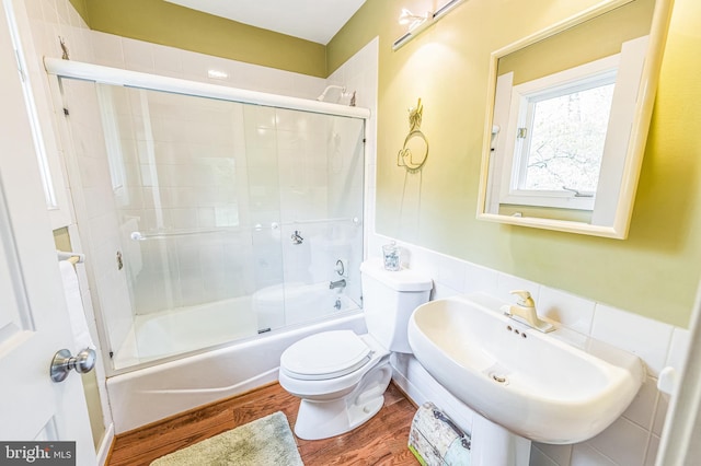 2010 Welsh Vly, Malvern, PA 19355 - full bath with combined bath / shower with glass door, wood finished floors, toilet, and a sink