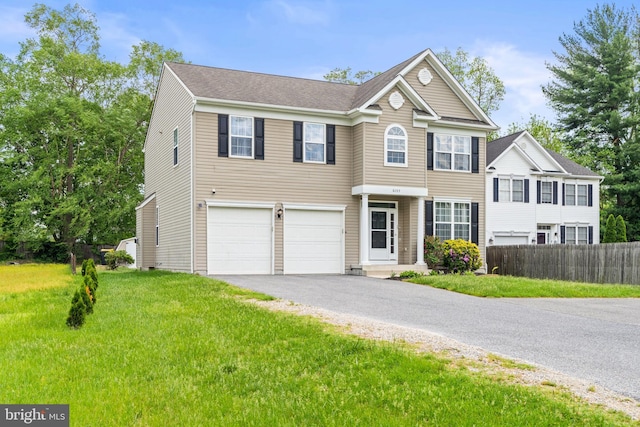 view of front of property with driveway and a garage