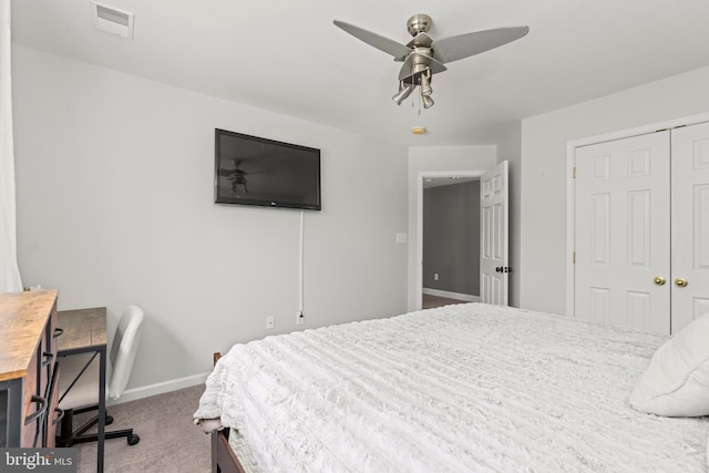 bedroom featuring carpet flooring, baseboards, a closet, and a ceiling fan