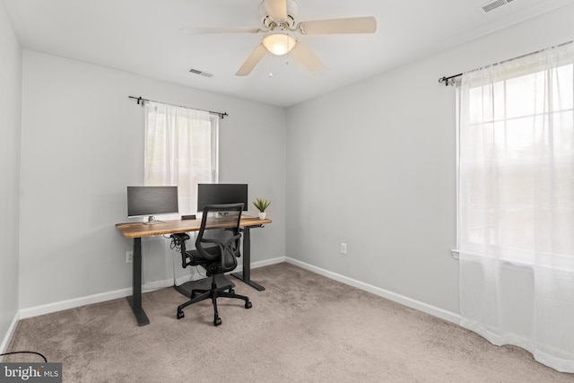 carpeted office with healthy amount of natural light, baseboards, and ceiling fan