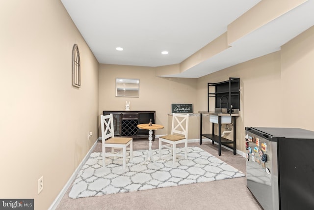 rec room featuring carpet flooring, baseboards, recessed lighting, and a sink
