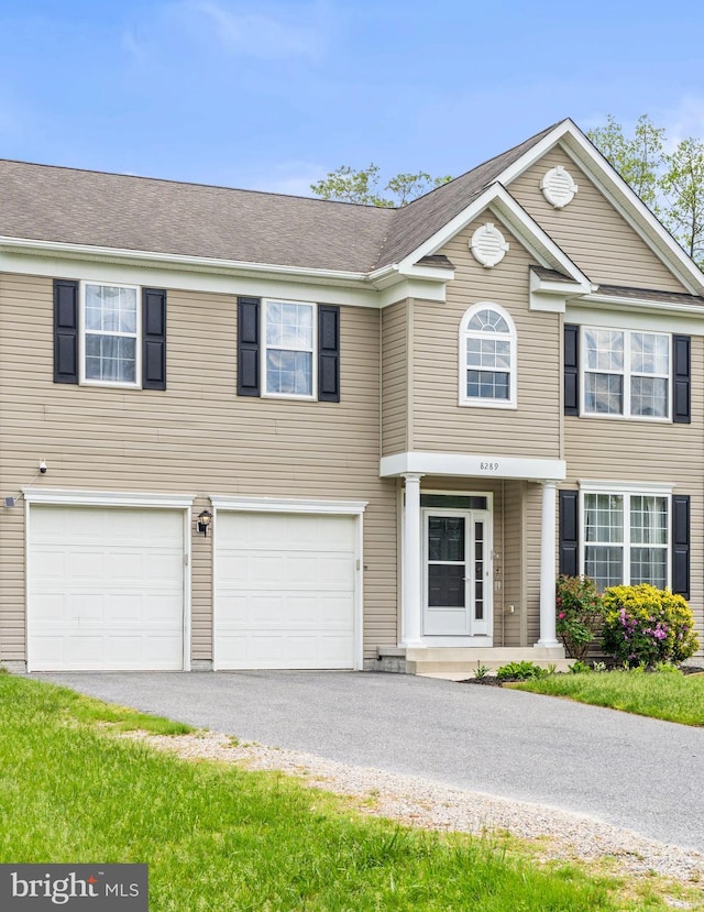 view of front facade featuring an attached garage and driveway