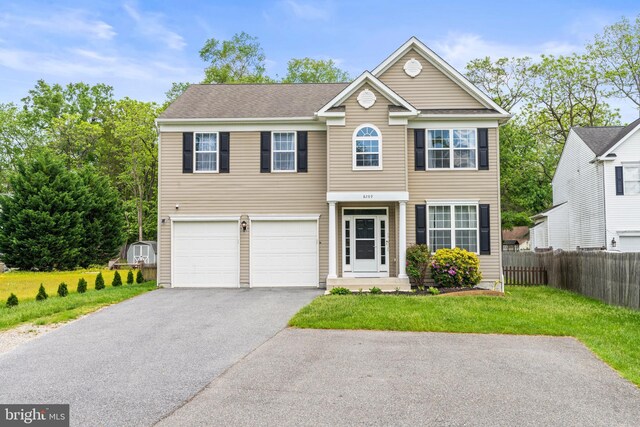 view of front of house with driveway and a garage
