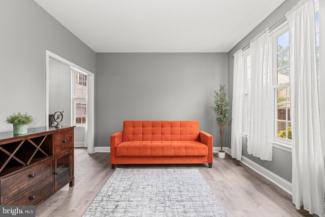 sitting room featuring wood finished floors and baseboards
