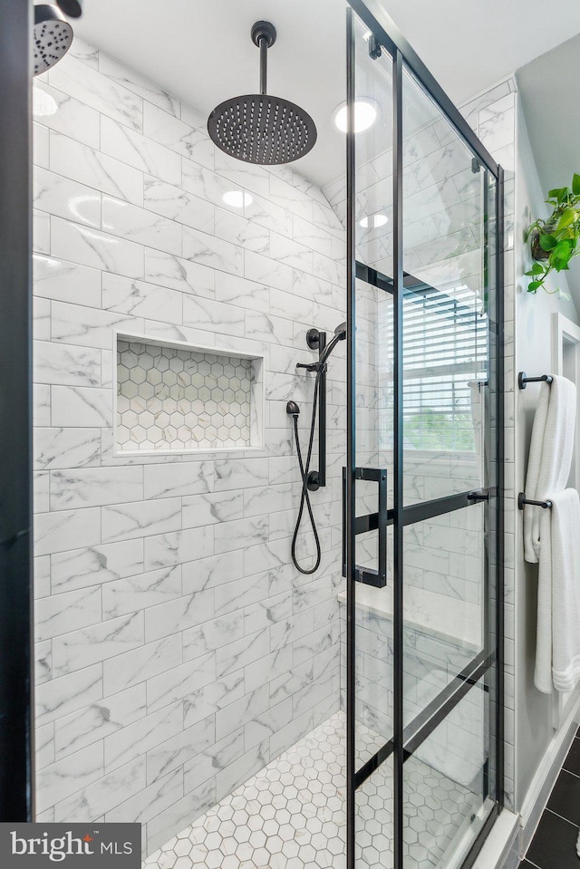 bathroom featuring a shower stall