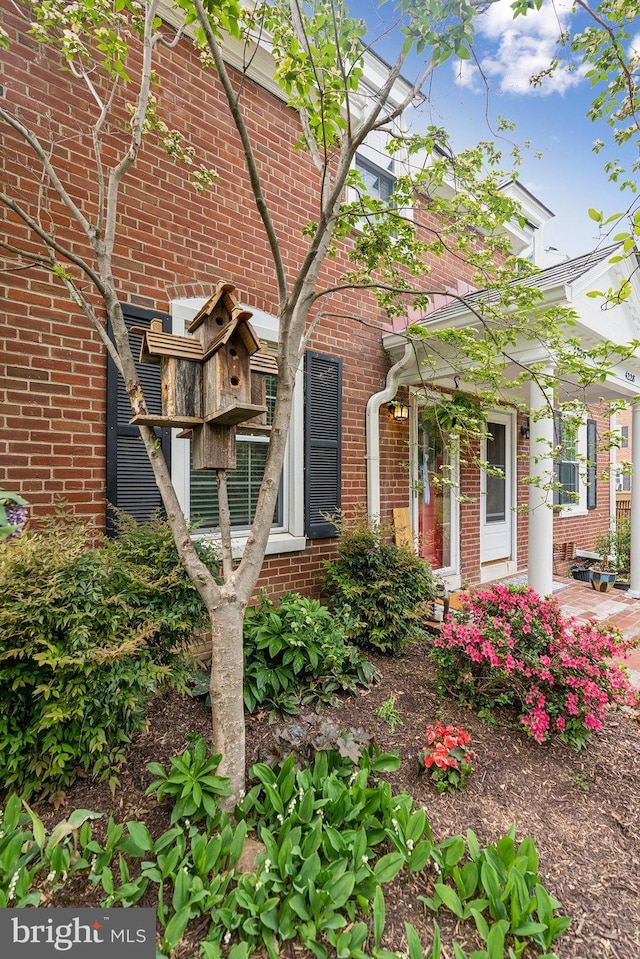 view of front of home with brick siding