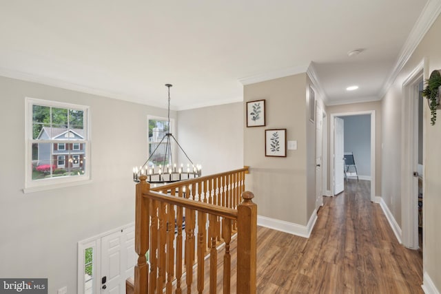 12527 Misty Water Dr, Herndon, VA 20170 - hall featuring crown molding, an upstairs landing, a chandelier, baseboards, and wood finished floors
