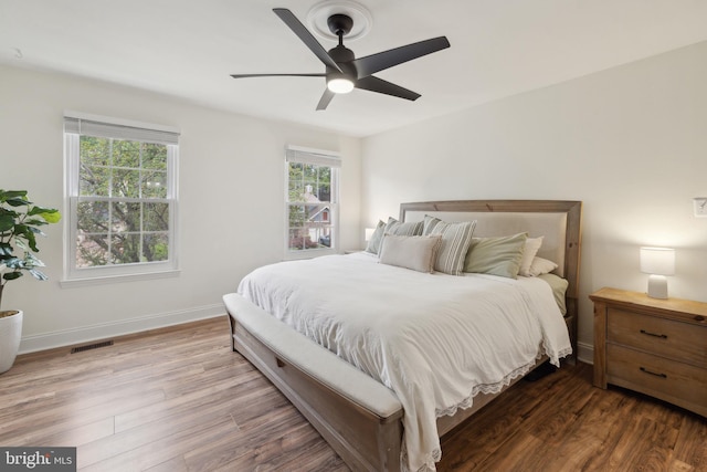 12527 Misty Water Dr, Herndon, VA 20170 - bedroom featuring a ceiling fan, visible vents, wood finished floors, and baseboards