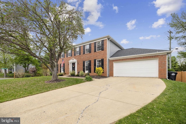 12527 Misty Water Dr, Herndon, VA 20170 - colonial house featuring brick siding, a front lawn, driveway, and an attached garage
