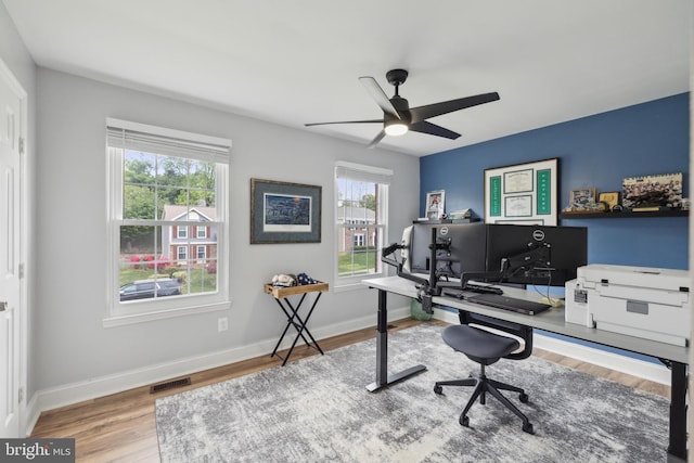 12527 Misty Water Dr, Herndon, VA 20170 - office area featuring wood finished floors, visible vents, ceiling fan, and plenty of natural light