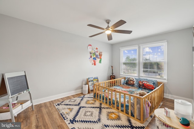 12527 Misty Water Dr, Herndon, VA 20170 - bedroom with ceiling fan, wood finished floors, and baseboards