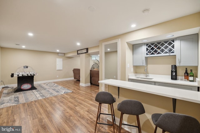 12527 Misty Water Dr, Herndon, VA 20170 - bar featuring wet bar, light wood-type flooring, recessed lighting, and a sink