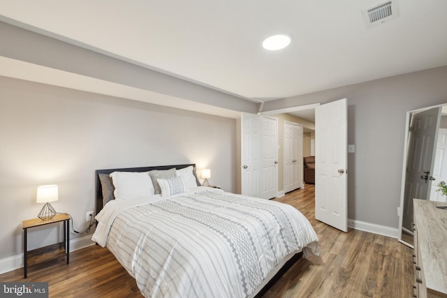 12527 Misty Water Dr, Herndon, VA 20170 - bedroom with wood finished floors, visible vents, and baseboards