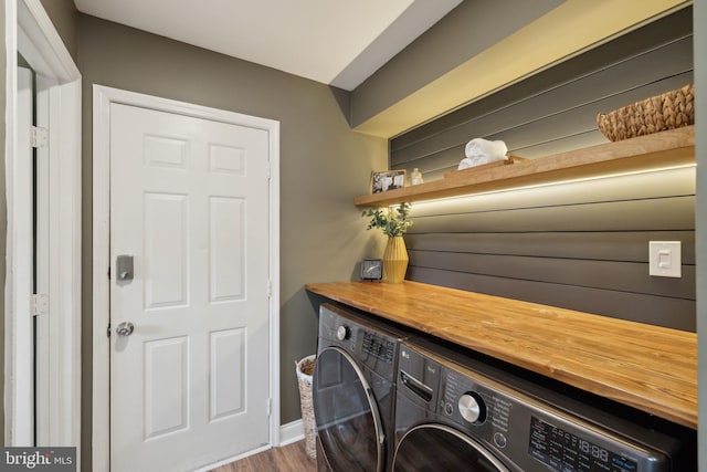 12527 Misty Water Dr, Herndon, VA 20170 - clothes washing area featuring separate washer and dryer, wood finished floors, and laundry area