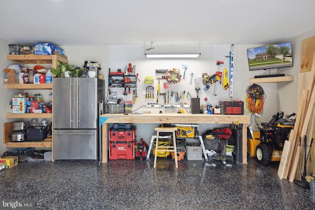 12527 Misty Water Dr, Herndon, VA 20170 - garage featuring a workshop area and high end refrigerator