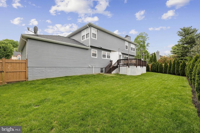 12527 Misty Water Dr, Herndon, VA 20170 - rear view of property with a wooden deck, stairway, a lawn, a chimney, and fence