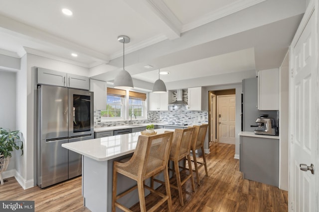 12527 Misty Water Dr, Herndon, VA 20170 - kitchen featuring smart refrigerator, gray cabinets, backsplash, wall chimney range hood, and wood finished floors