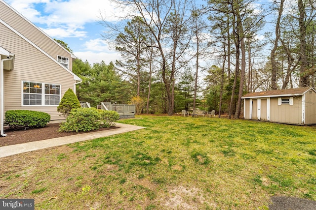 25 Blueberry Run, Southampton, NJ 08088 - view of yard with a wooden deck, a storage unit, and an outbuilding