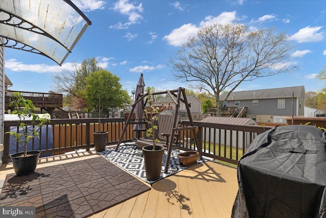 wooden deck featuring a residential view