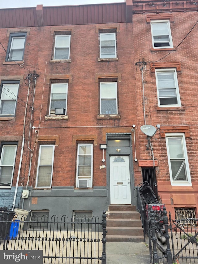 2009 E Allegheny Ave, Philadelphia, PA 19134 - multi unit property featuring brick siding and a fenced front yard