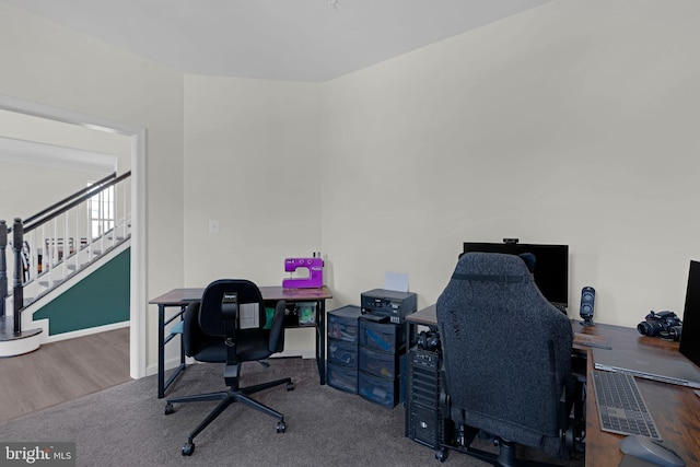 office space with baseboards and wood finished floors