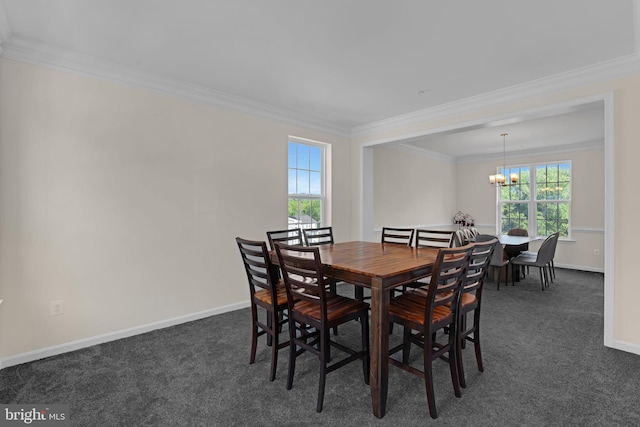dining room with crown molding and dark colored carpet