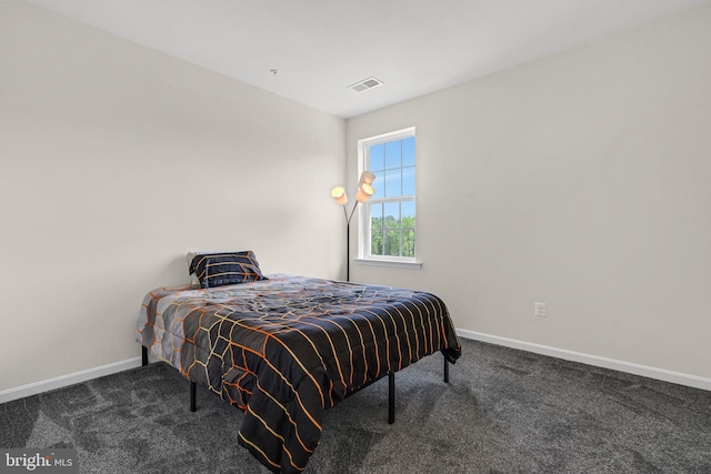 carpeted bedroom with baseboards and visible vents