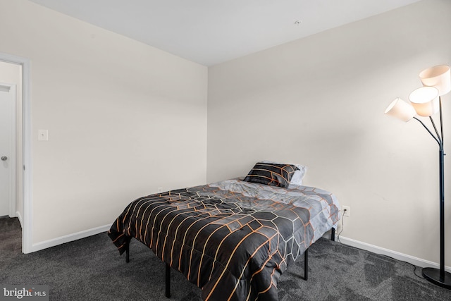carpeted bedroom with baseboards