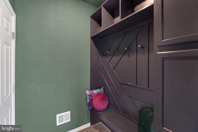mudroom featuring baseboards and visible vents