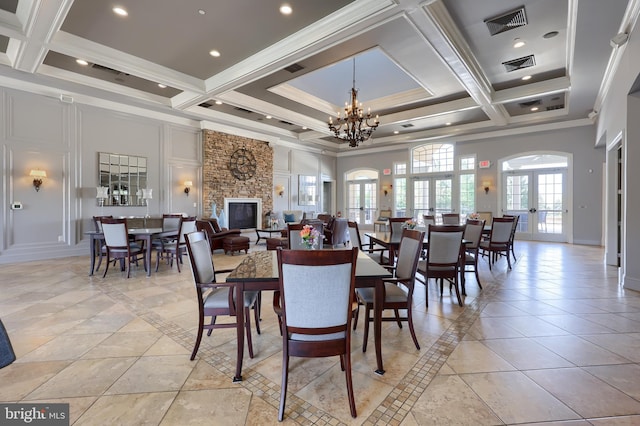 dining area featuring beamed ceiling, coffered ceiling, and visible vents