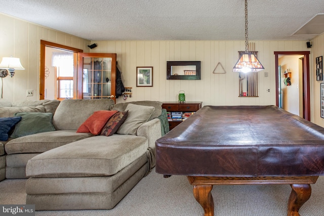 game room with billiards, carpet flooring, and a textured ceiling