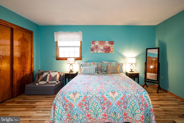 bedroom featuring a closet and wood finished floors