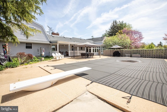 exterior space featuring a patio and fence